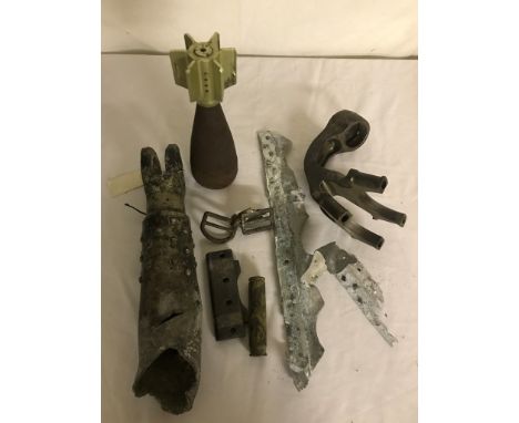 A quantity of WWII crash relics of German aircraft; together with engine parts