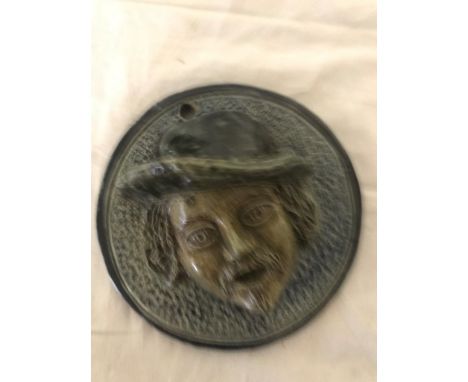 An early 19th century Fulham pottery stoneware vesta wall plaque depicting an old mans head in relief. Verso with incised mar