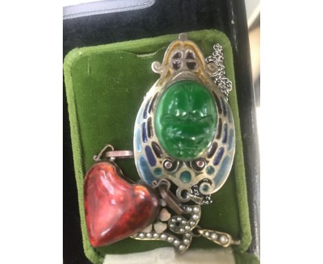 Three Art Nouveau brooches to include enamelled heart on copper, pearl and enamel and spinel brooch and an Austro-Hungarian p