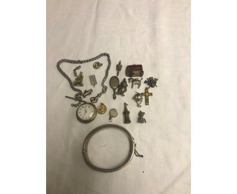 A silver bangle; together with silver charms