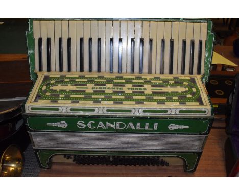 An accordion by Scandalli, Vibrante three, in green with diamante decoration.