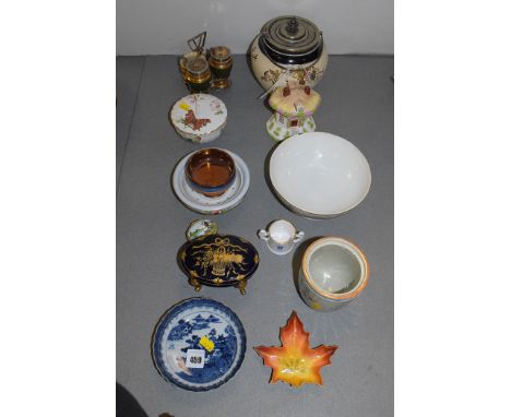 A Worcester style saucer; a Coalport thatched cottage; Royal Worcester sycamore leaf shaped dish, No. G481; a cruet set; copp
