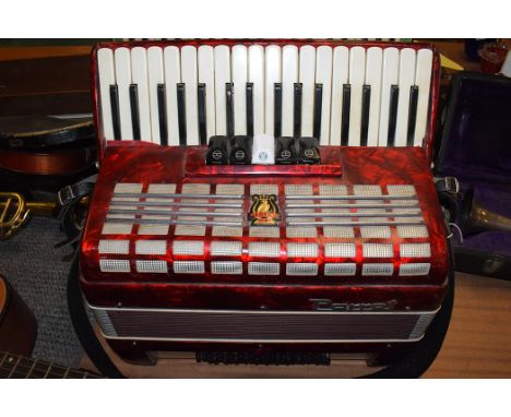 A Parrot accordion in red case, No.816.