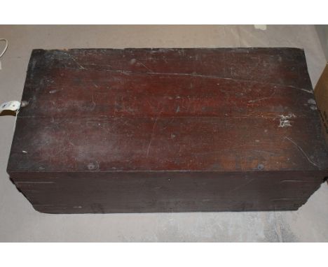 A stained wood trunk with metal bindings.