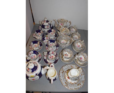 A 19th Century Rockingham style part tea service, in grey, gilt and floral decoration, comprising: teapot, sugar pot and cove