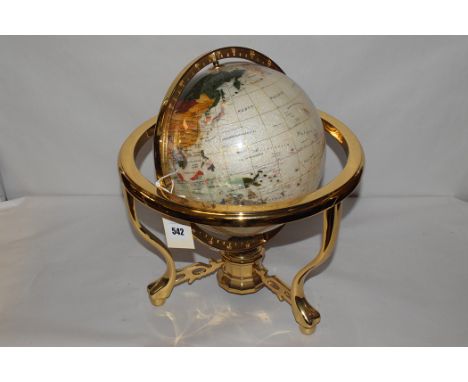 A modern terrestrial globe with compass to underside, brass mounts.