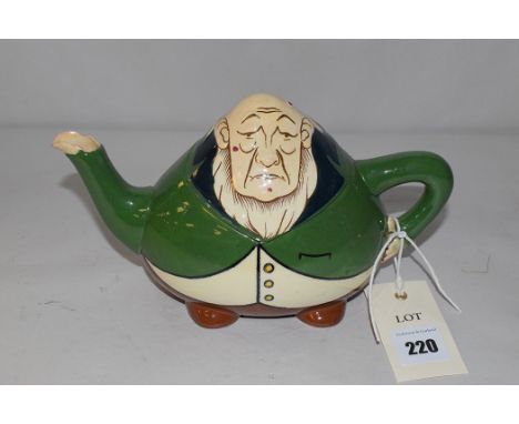 A Foley 'Intarsio' ceramic teapot in the form of a comical figure, inscribed '3246' on the base and 'RD363131'.