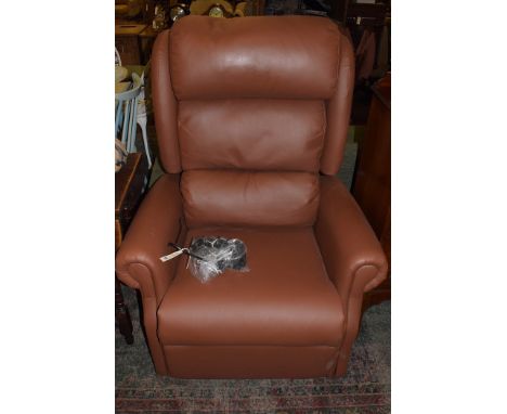 A modern brown leatherette electric recliner chair, retailed by Peach The Chair Shop, Newcastle, manufactured by Seminar Comp