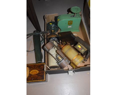 A Victorian glass and cast metal oil lamp base; a stoneware hot water bottle; biscuit tins; lamp shades; and sundries.