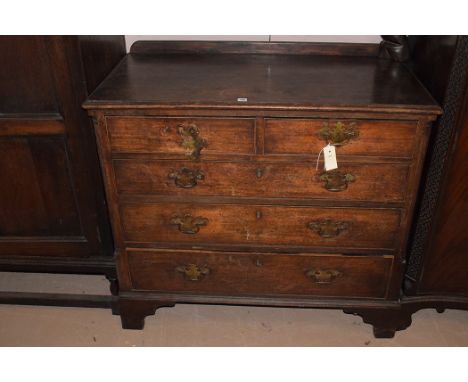 A Georgian mahogany chest of two short and three long graduating (later handles) drawers, raised on bracket feet, 97.5cms wid
