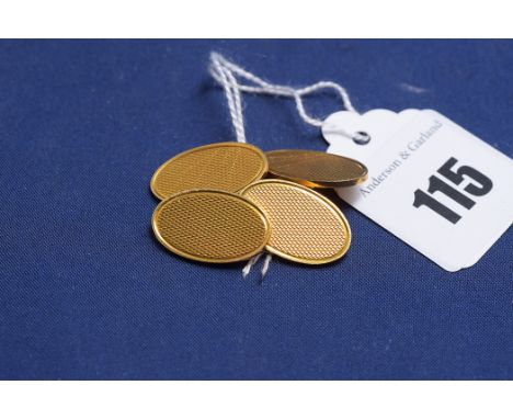 A pair of yellow gold 18ct cufflinks, oval pattern with engine turned decoration, 16.1grms.
