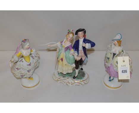 Two Neopolitan ceramic figures of 18th Century dressed ladies; and a Dresden group of a gentleman and a lady. (3)