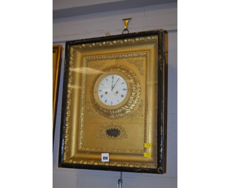 A late 19th Century eight-day wall clock, roman enamel dial, mounted on gold coloured frame enclosed within a glazed case.