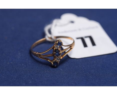 A sapphire and diamond ring on yellow metal shank (mark rubbed), ring size R.