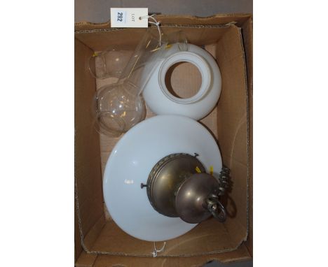 A Victorian style centre ceiling hanging light fitting with opaque shade; an oil lamp with opaque shade; and two oil lamp chi