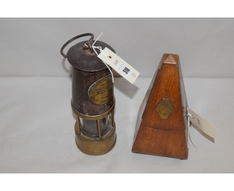 The Protector Lamp & Lighting Co. Ltd., safety lamp, Type S.L.; and a metronome in mahogany case.  (2)
