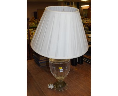 A 20th Century glass table lamp, with cream coloured shade.