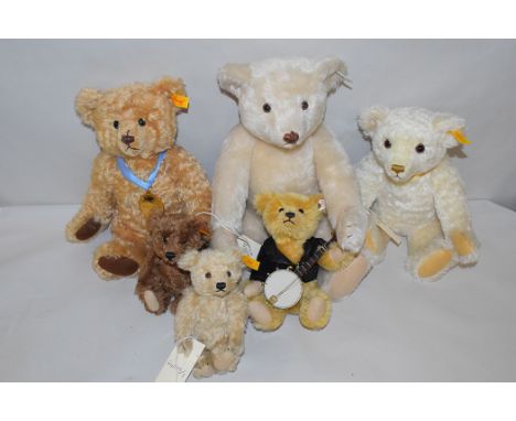 Teddy bears by Steiff to include a Danbury Mint 2002 mohair year bear no. 660344; a Millenium mohair bear no. 654701; two min