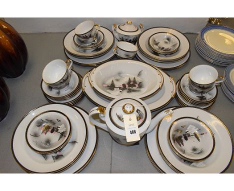 A part tea and dinner service by Kutani, to include: teapot, tea cups and saucers, soup bowls and dinner plates.