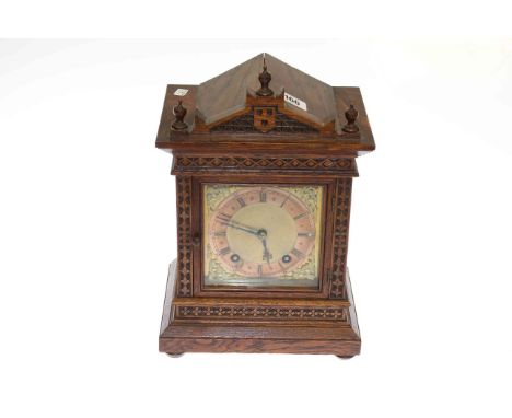 Oak cased mantel clock with brass and silvered dial