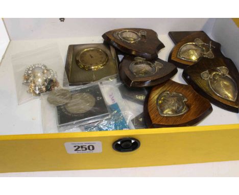 Engine-turned desk clock, coins, silver-mounted shield trophies