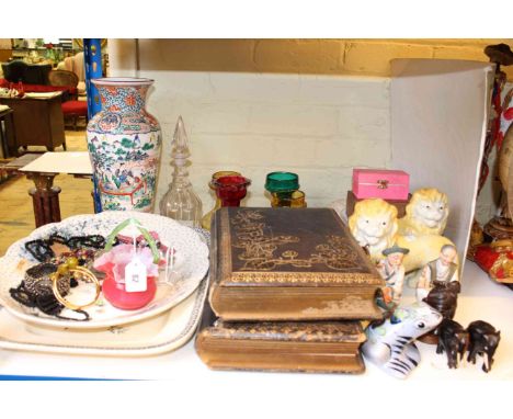 Brass firescreen, two Victorian photograph albums, glass decanter and vases, pair of pottery lions, meat plates, china and je