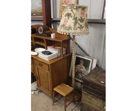 A cane seated stool and a barley twist standard lamp and shade
