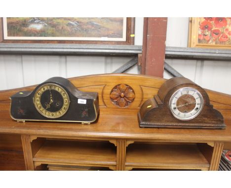 A three hole oak cased eight day mantel clock; and a floral and gilt decorated two hole mantel clock 