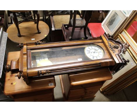 A Victorian walnut regulator wall clock, the white enamel Roman Numeral dial inscribed A. Tucker Rainham, approx. 111cm long 