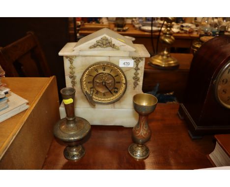 An agate cased two hole mantel clock AF; and two Eastern decorative brass vases 