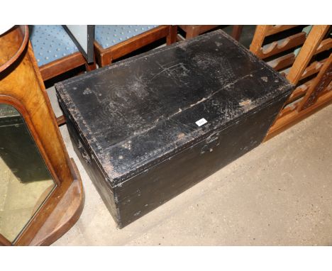 A black painted trunk and contents of small rug, leather bound Bible, gilt upholstered footstool AF, loom shuttles, various b