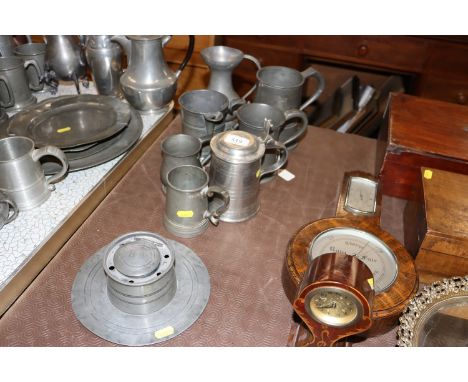 A quantity of antique and later pewter tankards and an inkwell&nbsp;