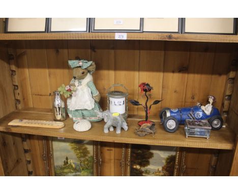 A quantity of various sundry items to include doorstop, novelty racing car figure, thermometer etc.