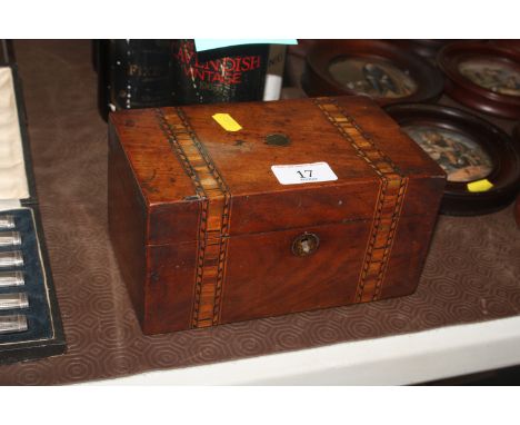 A Victorian inlaid walnut two compartment tea caddy