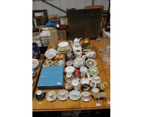 A collection of various china to include boxed lacquered Oriental tea set, various cups and saucers, piggy banks, Portmeirion