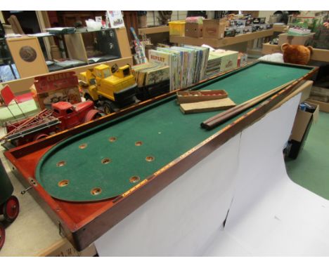 A Victorian mahogany folding billiard/bagatelle table with cues and balls, baize a/f