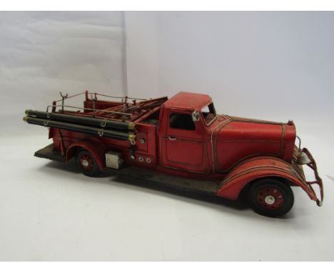 A modern tinplate model of a 1950's fire engine