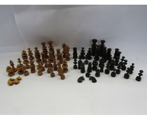 A mixture of late 19th/early 20th Century turned and carved boxwood and ebonized chess pieces (some a/f)