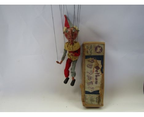 A Pelham Puppets type SM Punch Puppet, wooden head with painted features and moving mouth, lead hands, in red, blue and yello