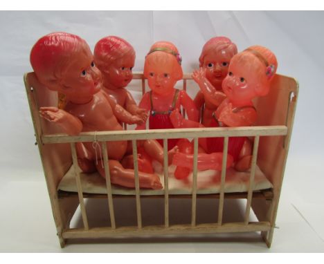 Two 1940's Japanese celluloid girl dolls and three boys in a vintage wooden dolls cot (6)