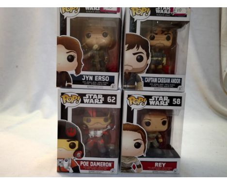 Four Star Wars Funko Pops, comprising Jyn Erso, Captain Cassian Andor, Poe Dameron and Rey. All appear in excellent condition