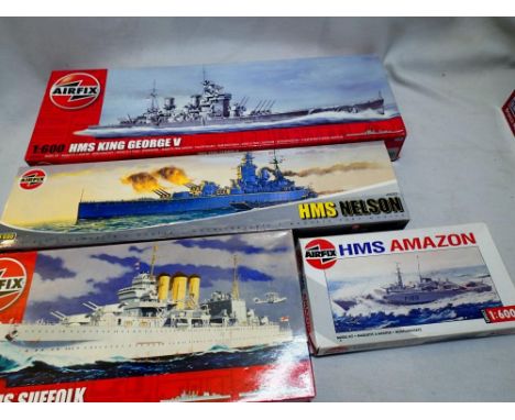 Four Airfix 1/600 scale ship kits to include H.M.S Amazon, H.M.S Suffolk, H.M.S Nelson and H.M.S King George V, appear comple