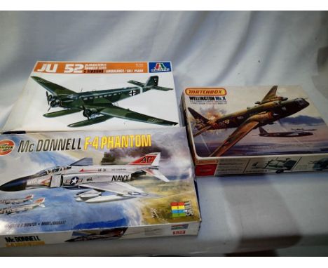 Three 1/72 scale aircraft kits to include Italaerei Ju52, Airfix F4 Phantom and Matchbox Wellington, appear complete/unchecke