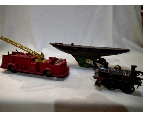 Three vintage toys for refurbishment including a Carette Clockwork 0.4.0 locomotive, a Triang tinplate yacht and a Marx fire 
