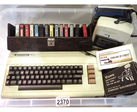 Commodore VIC20 games console, with C2N cassette, power supply and a quantity of game cartridge cassettes. P&amp;P Group 2 (£