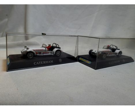 Two Scalextric Caterham Cup racing cars to include No. 2 Drive Donnington and No. 3 Drive Croft Circuit, no front wings or li