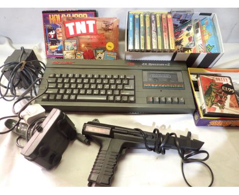 Sinclair ZX Spectrum plus two 128k games console, with two peripherals, power supply and a quantity of game cartridge cassett