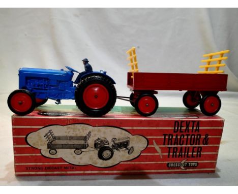 Crescent toys to include Dexta tractor and trailer, in good condition, some minor print loss and one split trailer type, box 