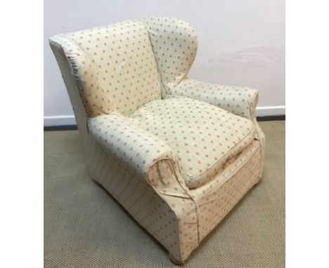 A modern green upholstered corner sofa suite, a modern upholstered scroll arm chair with terracotta loose covers and a modern