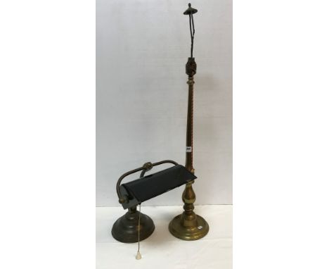 A circa 1900 brass and painted tin desk lamp of typical form and a brass baluster shaped table lamp with shade holder, 85 cm 